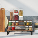 Wooden shelf with various jars of snacks on a kitchen counter.